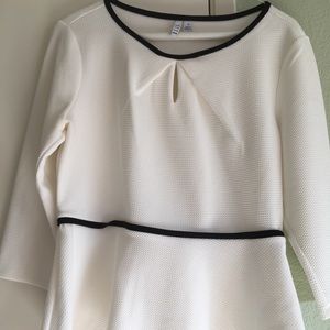 White flowy top from Elle with black trim.